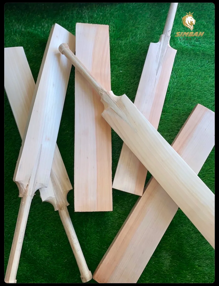 Unshaped English willow clefts and a bat handle laid out at the Simbah workshop