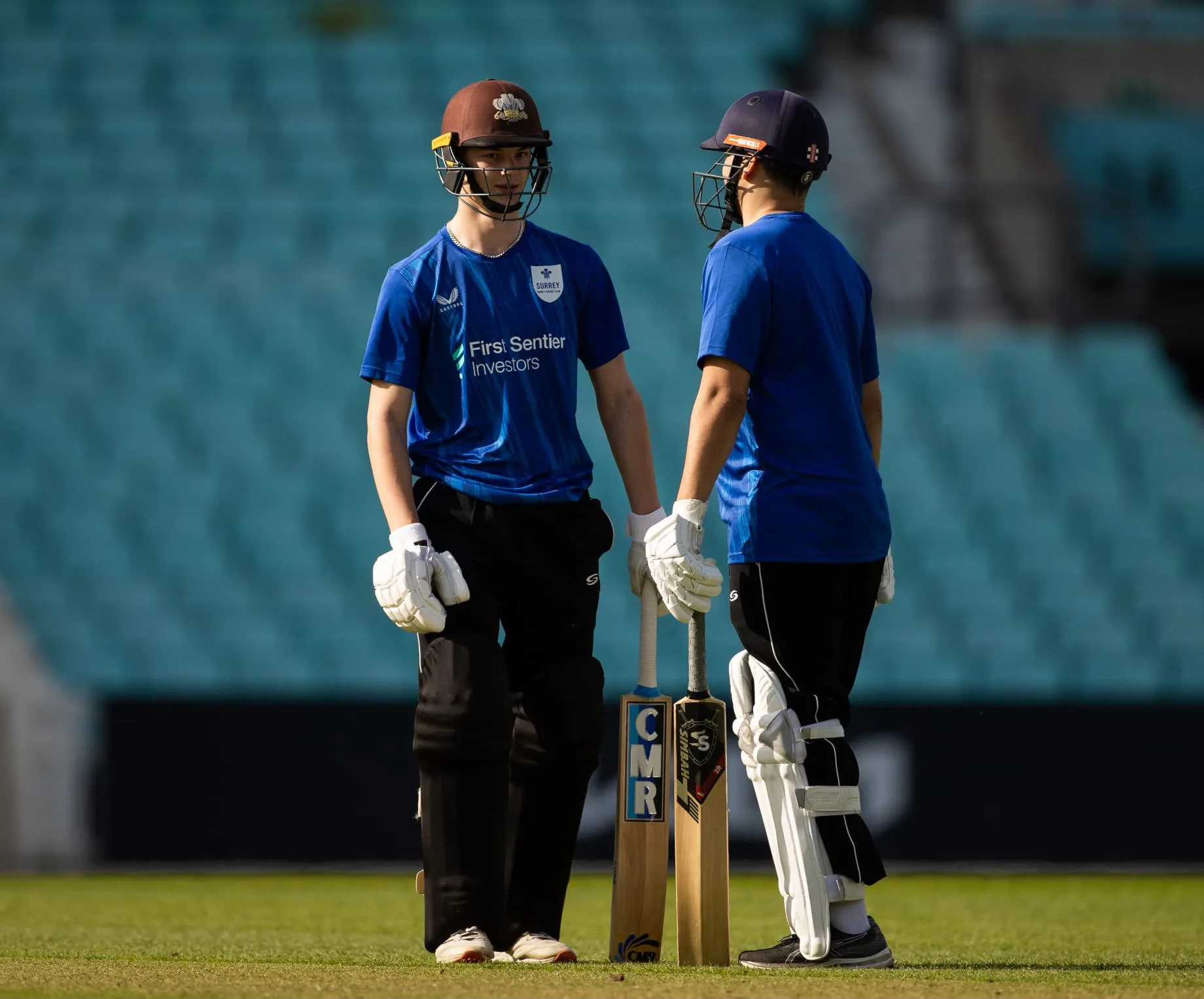 Two young players at the Oval with a Simbah bat